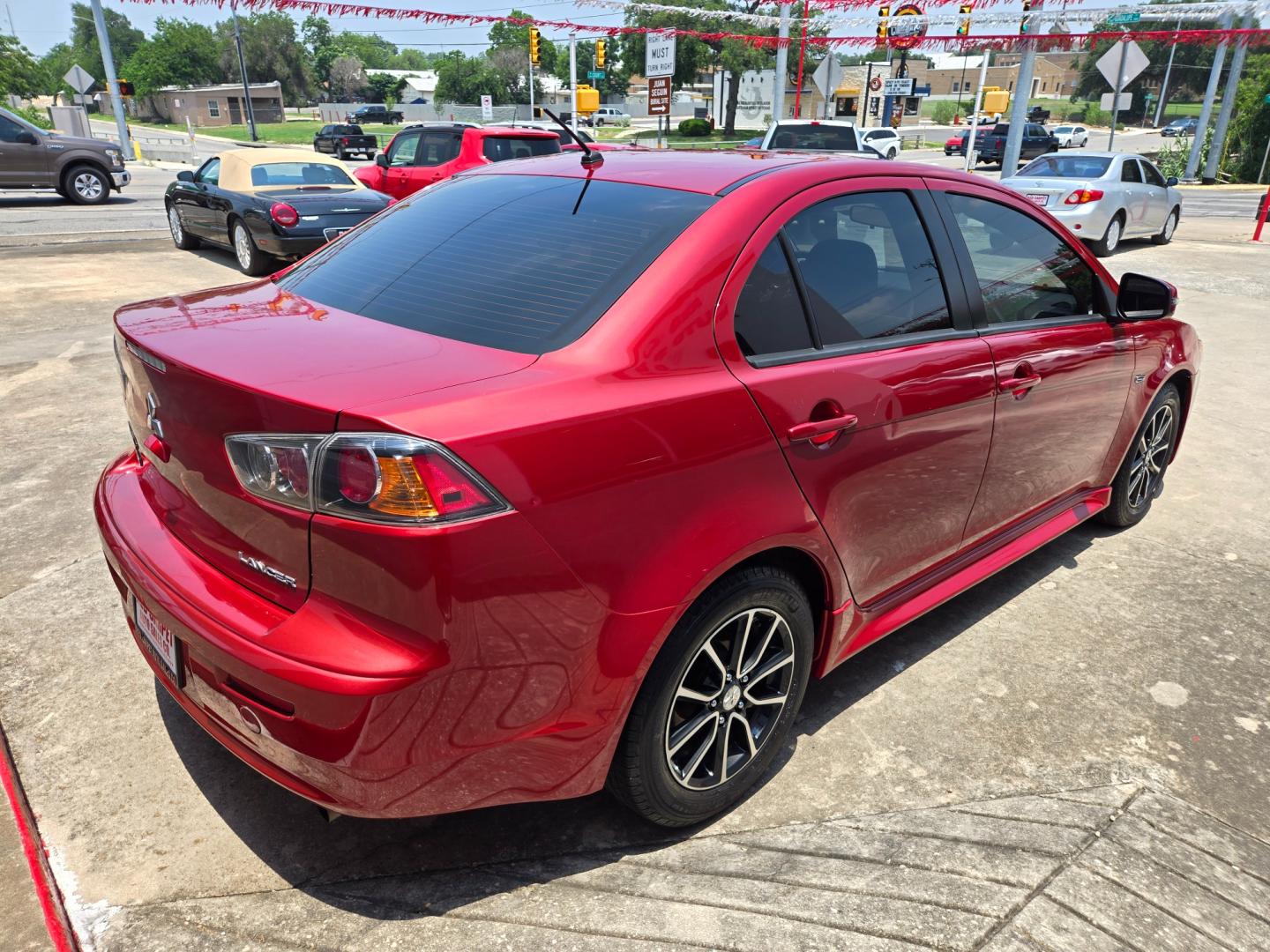 2017 Red /Black Mitsubishi Lancer ES 5M (JA32U2FU2HU) with an 2.0L L4 SOHC 16V engine, Automatic transmission, located at 503 West Court, Seguin, TX, 78155, (830) 379-3373, 29.568621, -97.969803 - Photo#2