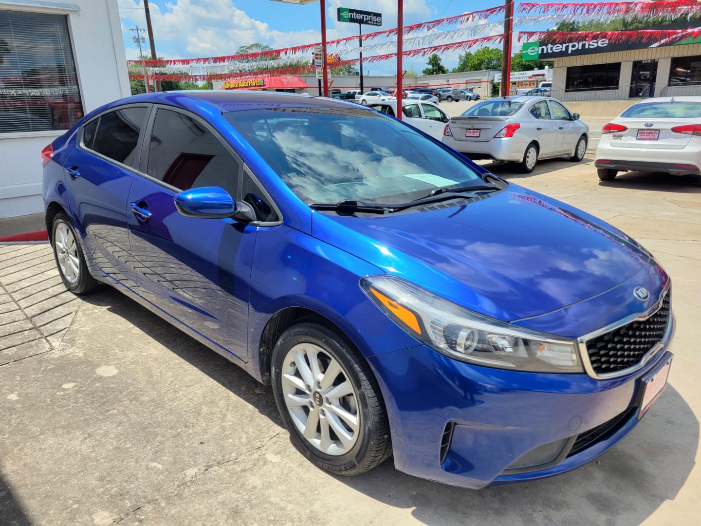 2017 Blue Kia Forte LX 6A (3KPFL4A74HE) with an 2.0L L4 DOHC 16V engine, 6A transmission, located at 503 West Court, Seguin, TX, 78155, (830) 379-3373, 29.568621, -97.969803 - Photo#1