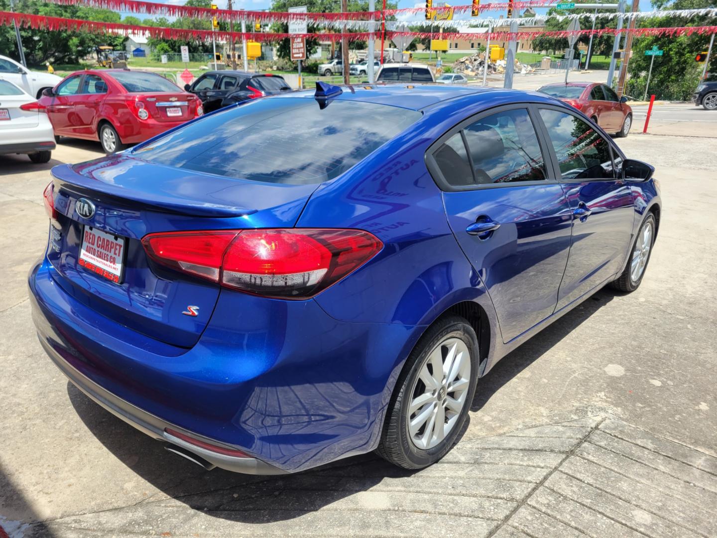 2017 Blue Kia Forte LX 6A (3KPFL4A74HE) with an 2.0L L4 DOHC 16V engine, 6A transmission, located at 503 West Court, Seguin, TX, 78155, (830) 379-3373, 29.568621, -97.969803 - 2017 Kia Forte S with a 2.0L L4 DOHC 16V, Automatic, Tilt, Cruise, AM/FM/AUX Touchscreen Stereo, Power Windows, Locks and Side Mirrors, Bluetooth, Tinted Windows, Automatic Headlights, Backup Camera, Alloy Wheels, Rear Defroster and More!! - Photo#2