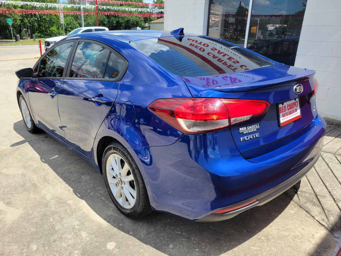 2017 Blue Kia Forte LX 6A (3KPFL4A74HE) with an 2.0L L4 DOHC 16V engine, 6A transmission, located at 503 West Court, Seguin, TX, 78155, (830) 379-3373, 29.568621, -97.969803 - Photo#3