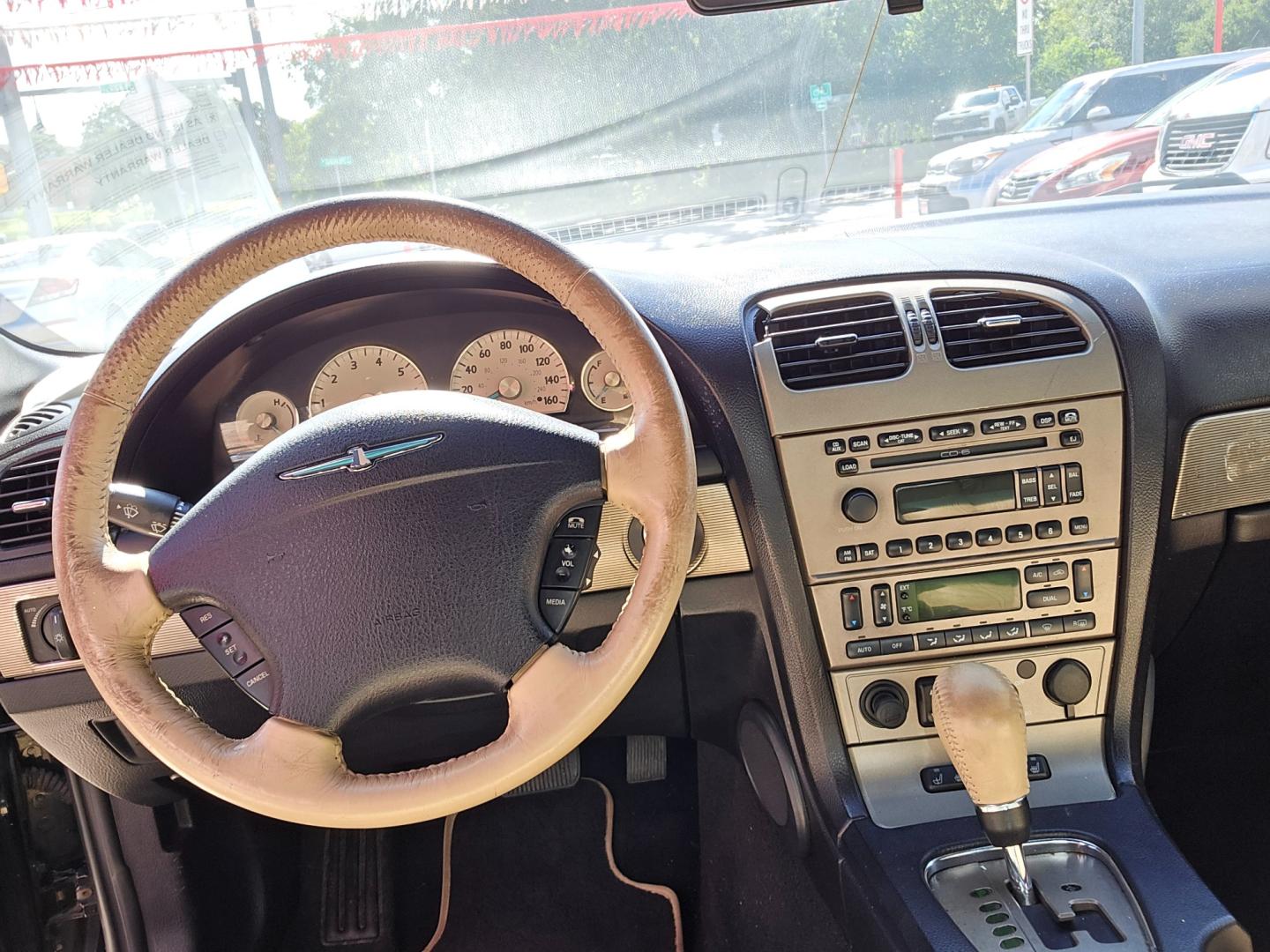 2004 Black /BEIGE Ford Thunderbird Deluxe (1FAHP60A14Y) with an 3.9L V8 DOHC 32V engine, 5-Speed Automatic Overdrive transmission, located at 503 West Court, Seguin, TX, 78155, (830) 379-3373, 29.568621, -97.969803 - 2004 Ford Thunderbird Deluxe with a 3.9L V8 DOHC 32V, Automatic, Tilt, Cruise, AM/FM/CD Stereo, Power Windows, Locks, Seat and Side Mirrors, Leather Seats, Automatic Headlights, Power Sunroof, Heated Seats, Convertible Soft Top, Alloy Wheels, Rear Defroster and more!! - Photo#5