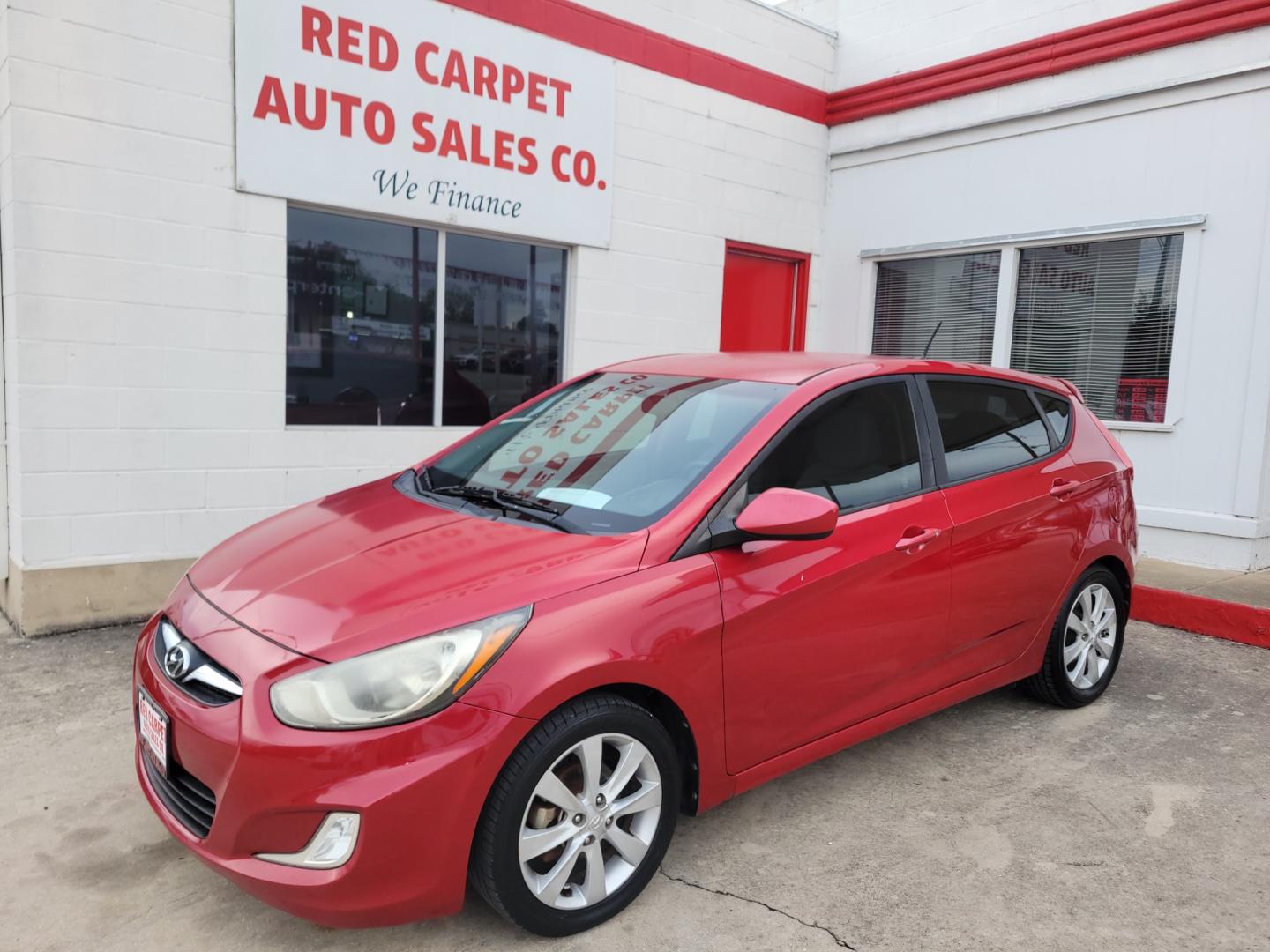 2012 Red /GRAY Hyundai Accent GS 5-Door (KMHCU5AE5CU) with an 1.6L L4 DOHC 16V engine, Manual Transmission transmission, located at 503 West Court, Seguin, TX, 78155, (830) 379-3373, 29.568621, -97.969803 - Photo#0