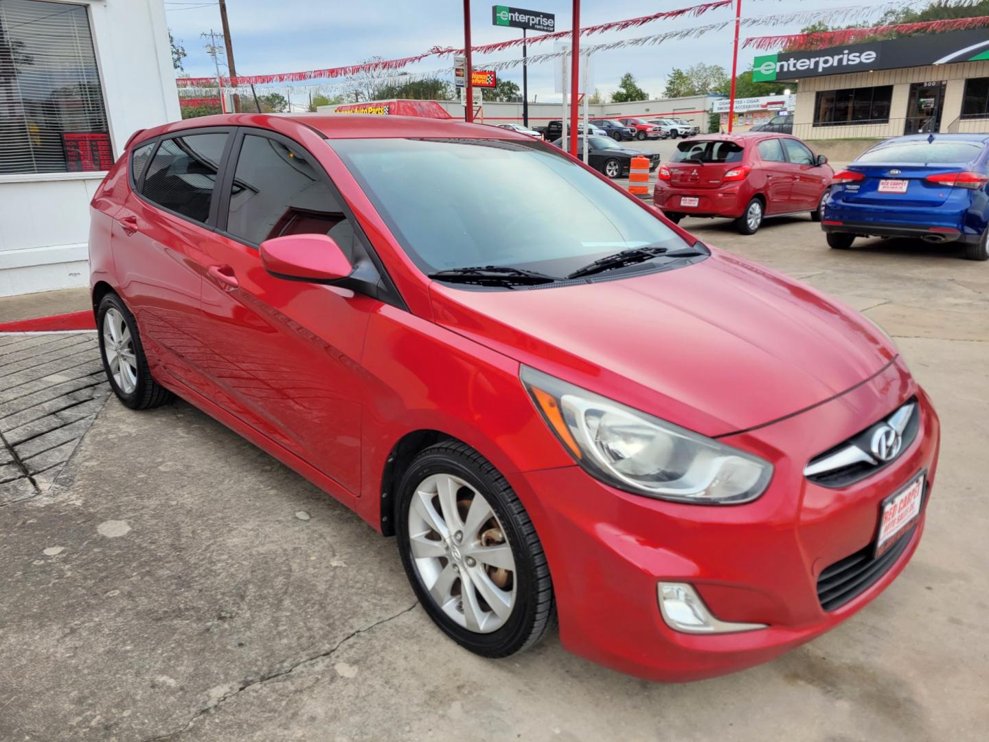 2012 Red /GRAY Hyundai Accent GS 5-Door (KMHCU5AE5CU) with an 1.6L L4 DOHC 16V engine, Manual Transmission transmission, located at 503 West Court, Seguin, TX, 78155, (830) 379-3373, 29.568621, -97.969803 - Photo#1