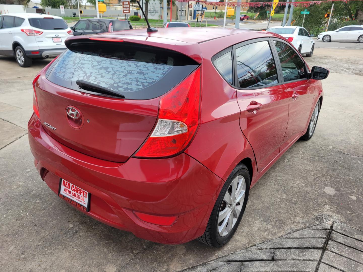 2012 Red /GRAY Hyundai Accent GS 5-Door (KMHCU5AE5CU) with an 1.6L L4 DOHC 16V engine, Manual Transmission transmission, located at 503 West Court, Seguin, TX, 78155, (830) 379-3373, 29.568621, -97.969803 - Photo#2