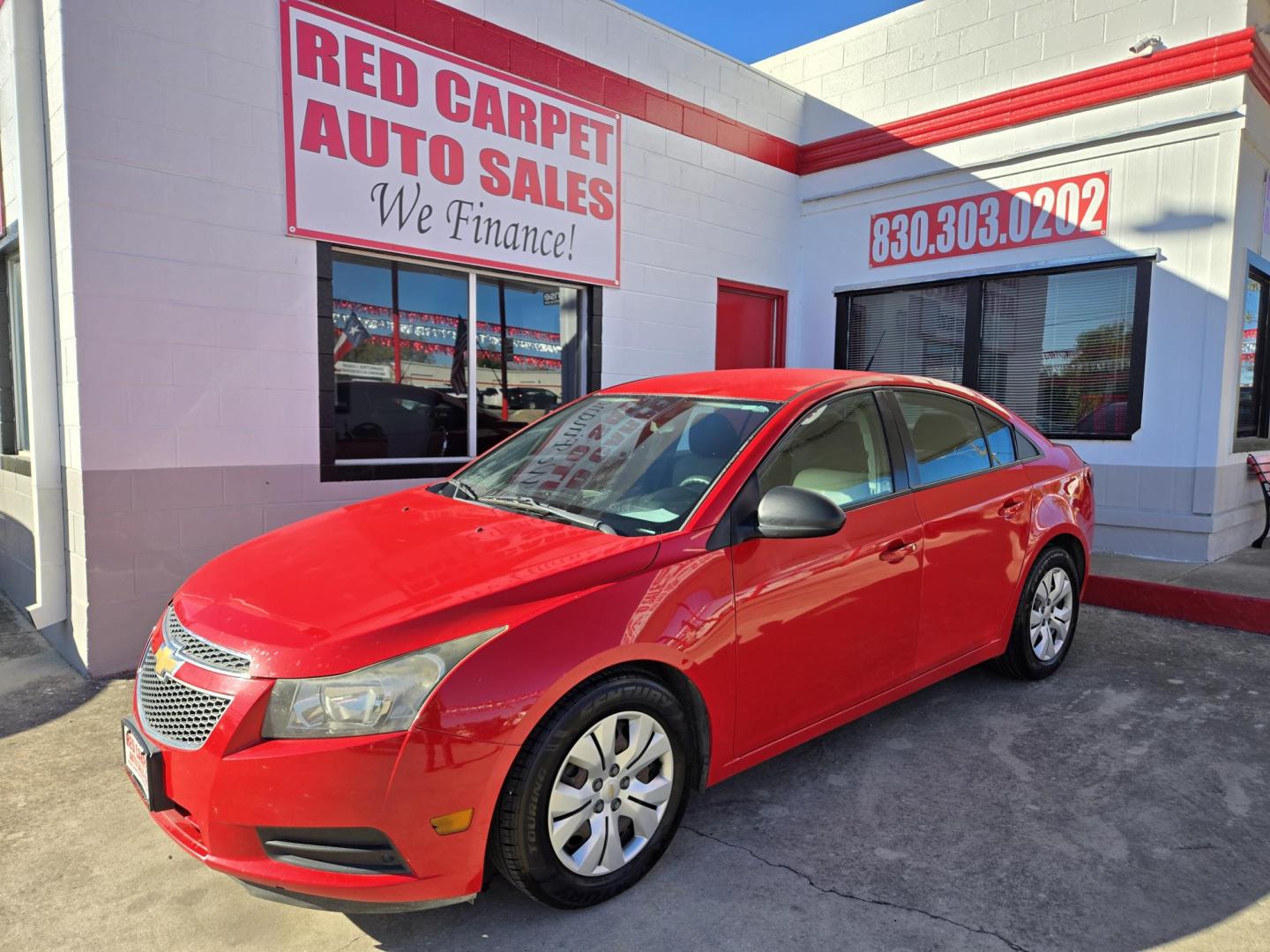 2014 Red Chevrolet Cruze LS Auto (1G1PA5SH8E7) with an 1.8L L4 DOHC 16V FFV engine, 6-Speed Automatic transmission, located at 503 West Court, Seguin, TX, 78155, (830) 379-3373, 29.568621, -97.969803 - Photo#0