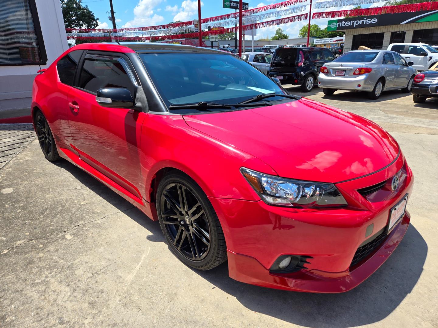 2013 Red Scion tC Sports Coupe 6-Spd AT (JTKJF5C74D3) with an 2.4L L4 DOHC 16V engine, Manual Transmission transmission, located at 503 West Court, Seguin, TX, 78155, (830) 379-3373, 29.568621, -97.969803 - Photo#1