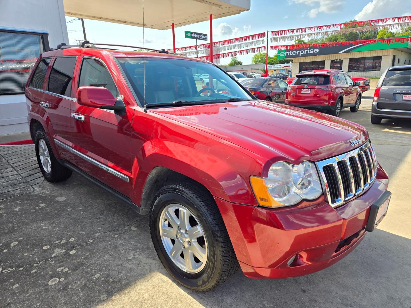 2010 Red Jeep Grand Cherokee Limited 4WD (1J4RR5GT9AC) with an 5.7L V8 OHV 16V engine, 5-Speed Automatic transmission, located at 503 West Court, Seguin, TX, 78155, (830) 379-3373, 29.568621, -97.969803 - Photo#1