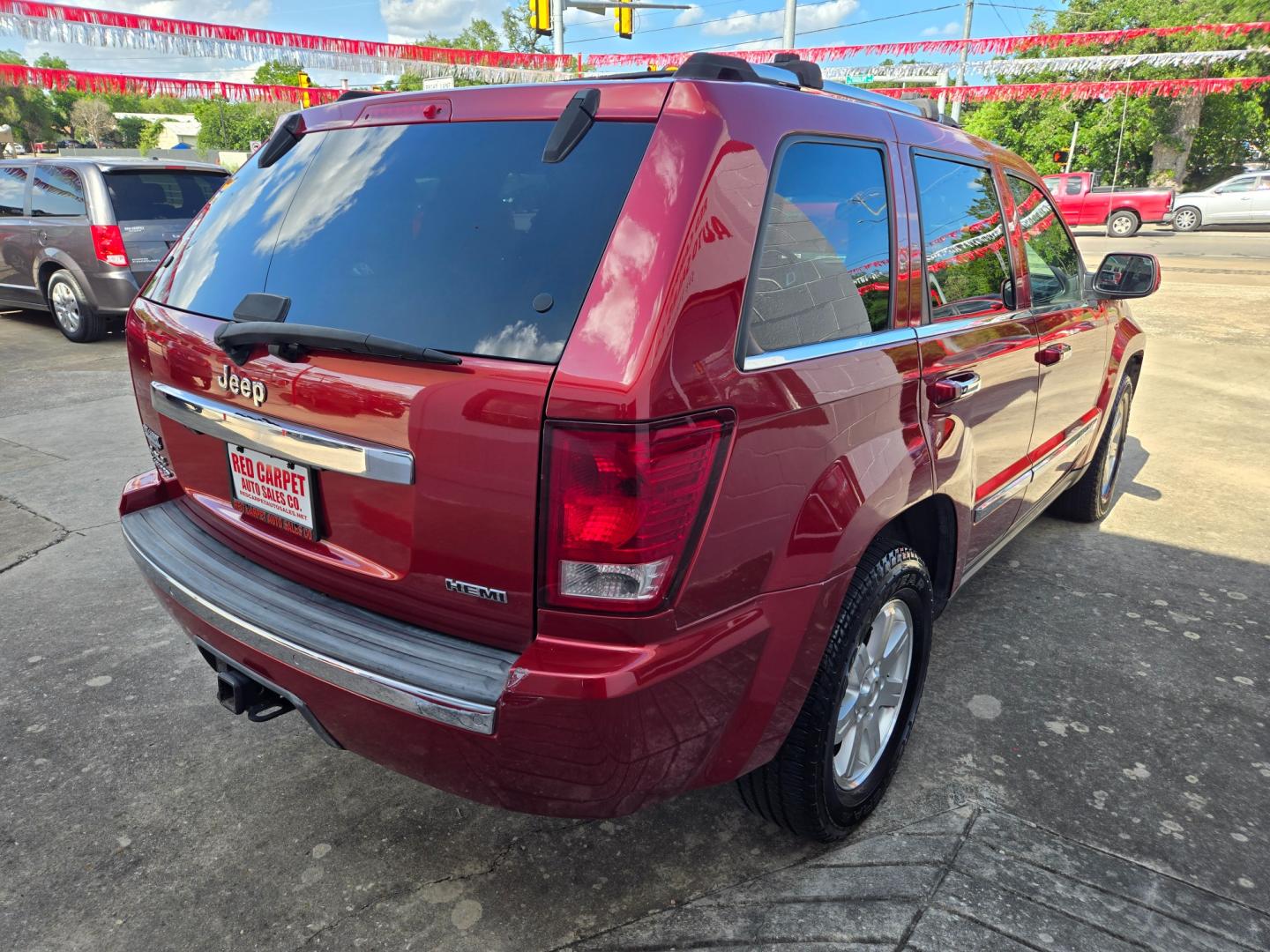 2010 Red Jeep Grand Cherokee Limited 4WD (1J4RR5GT9AC) with an 5.7L V8 OHV 16V engine, 5-Speed Automatic transmission, located at 503 West Court, Seguin, TX, 78155, (830) 379-3373, 29.568621, -97.969803 - Photo#2