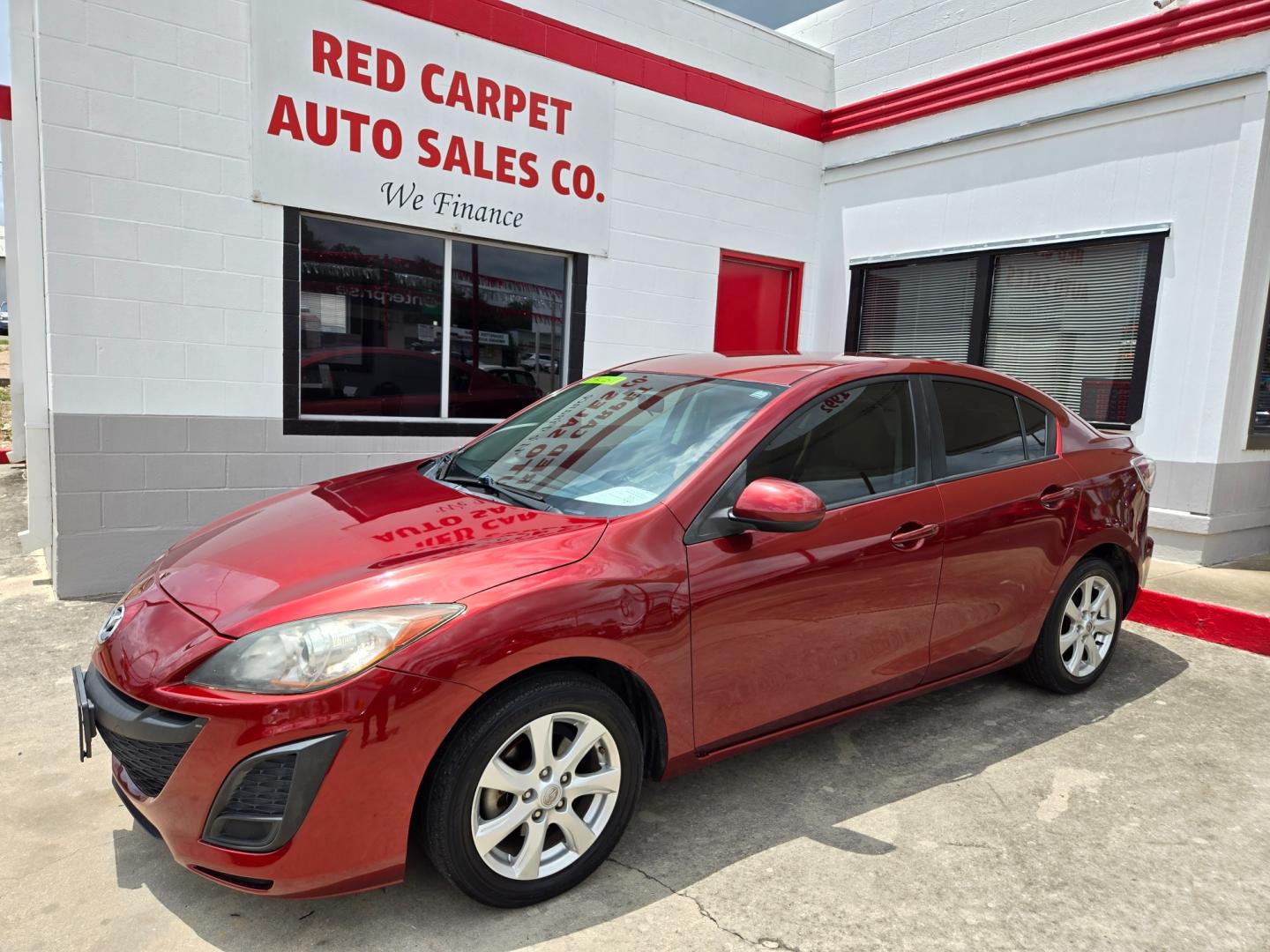 2011 Red Mazda MAZDA3 i Touring 4-Door (JM1BL1VG1B1) with an 2.0L L4 DOHC 16V engine, Automatic transmission, located at 503 West Court, Seguin, TX, 78155, (830) 379-3373, 29.568621, -97.969803 - Photo#0