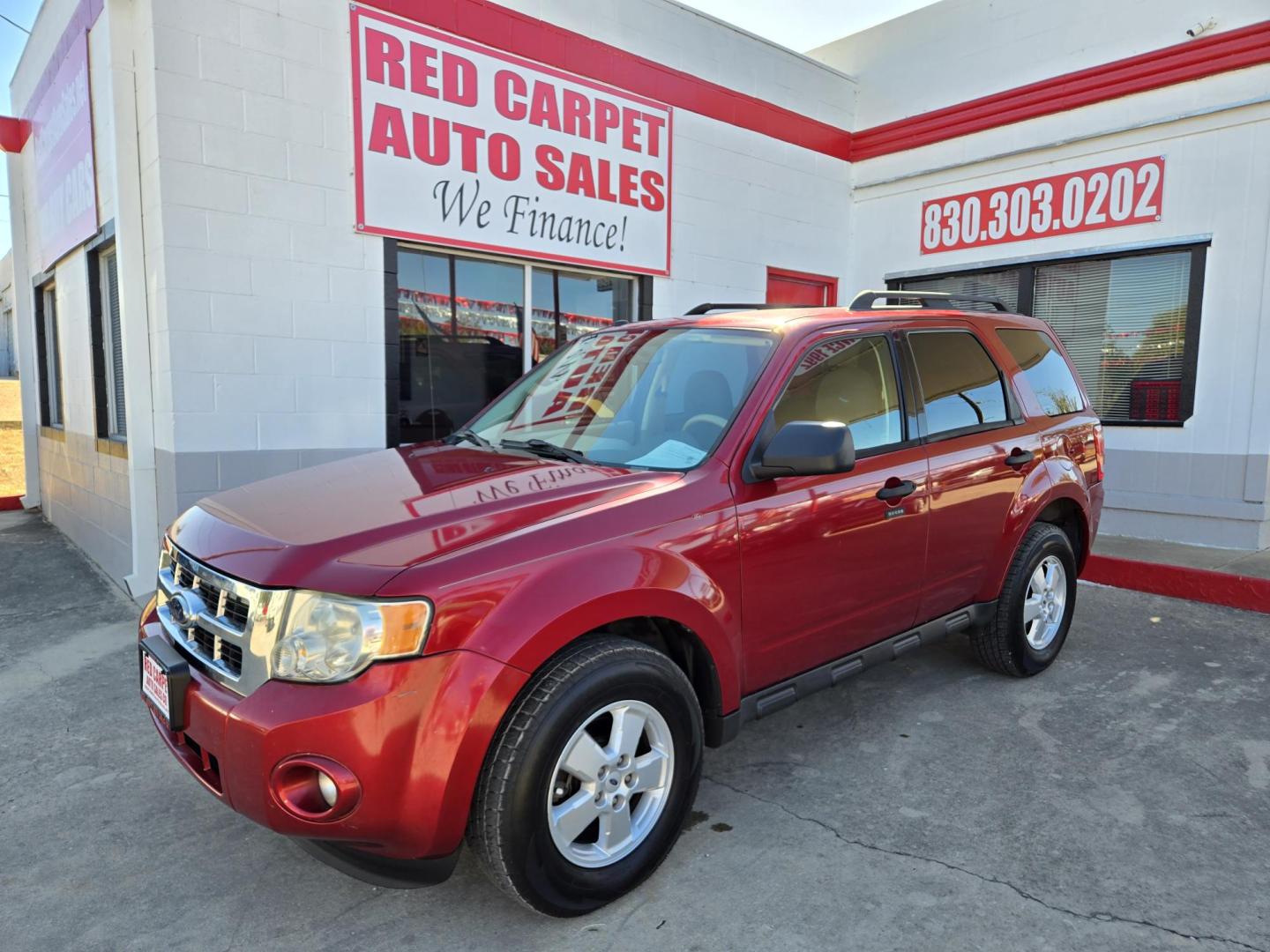 2009 Red Ford Escape XLT FWD V6 (1FMCU03G49K) with an 3.0L V6 DOHC 24V engine, 4-Speed Automatic transmission, located at 503 West Court, Seguin, TX, 78155, (830) 379-3373, 29.568621, -97.969803 - Photo#0