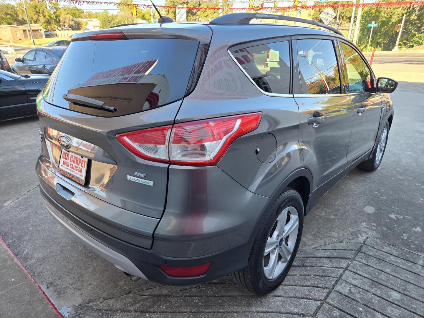 2014 GRAY Ford Escape SE FWD (1FMCU0GX2EU) with an 1.6L L4 DOHC 16V engine, 6-Speed Automatic transmission, located at 503 West Court, Seguin, TX, 78155, (830) 379-3373, 29.568621, -97.969803 - *Cash Special* 2014 Ford Escape SE FWD with a 1.6L L4 DOHC 16V, Automatic, Tilt, Cruise, AM/FM/CD Touchscreen Stereo, Power Windows, Locks, Seat and Side Mirrors, Bluetooth, Dual Climate Control, Rear A/C, Tinted Windows, Backup Camera, Bumper Sensors, Alloy Wheels, Rear Wiper, Rear Defroster and mo - Photo#2