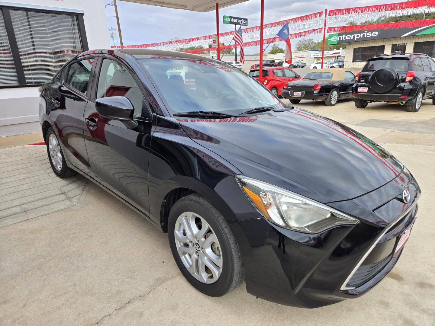 2018 Black Toyota Yaris iA 6A (3MYDLBYV8JY) with an 1.5L L4 DOHC 16V engine, Automatic transmission, located at 503 West Court, Seguin, TX, 78155, (830) 379-3373, 29.568621, -97.969803 - 2018 Toyota Yaris iA with a 1.5L L4 DOHC 16V, Automatic, Tilt, Cruise, AM/FM/AUX Stereo, Power Windows, Locks and Side Mirrors, Bluetooth, Backup Camera, Alloy Wheels, Rear Defroster and more!! - Photo#1