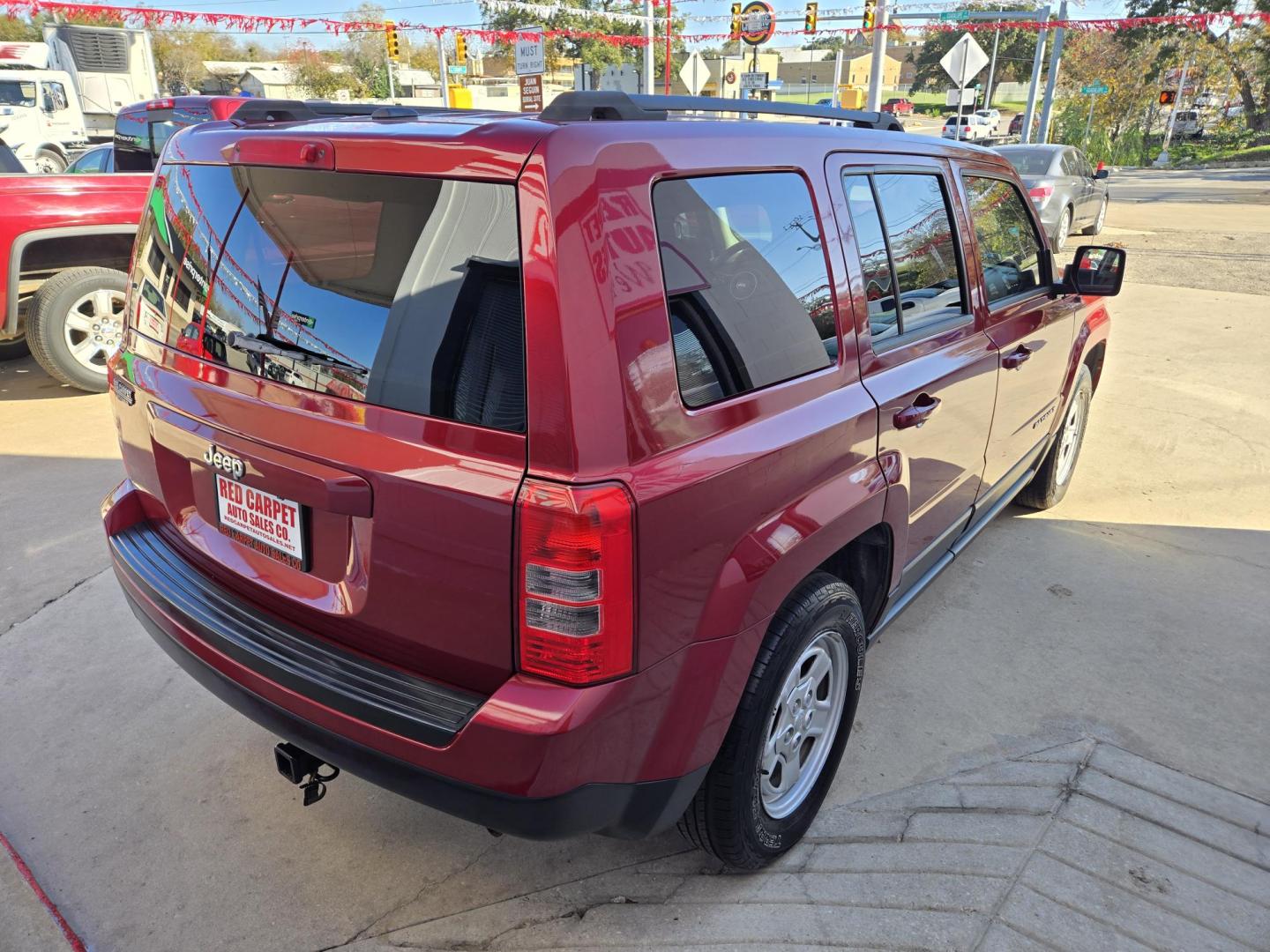 2015 Red Jeep Patriot Sport 2WD (1C4NJPBB7FD) with an 2.4L L4 DOHC 16V engine, Automatic transmission, located at 503 West Court, Seguin, TX, 78155, (830) 379-3373, 29.568621, -97.969803 - 2015 Jeep Patriot Sport 2WD with a 2.4L L4 DOHC 16V, Automatic, Tilt, Cruise, AM/FM Touchscreen Stereo, Power Windows, Locks and Side Mirrors, Tinted Windows, Alloy Wheels, Rear Wiper, Rear Defroster and more!! - Photo#2