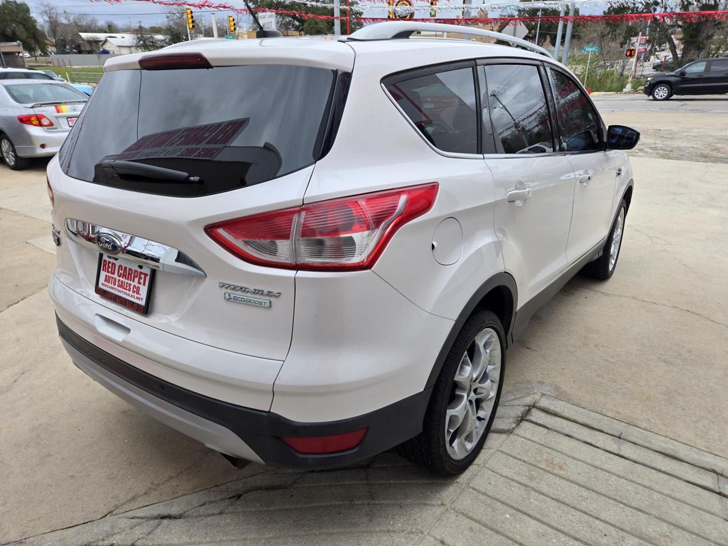 2014 WHITE Ford Escape Titanium FWD (1FMCU0JX4EU) with an 1.6L L4 DOHC 16V engine, 6-Speed Automatic transmission, located at 503 West Court, Seguin, TX, 78155, (830) 379-3373, 29.568621, -97.969803 - 2014 Ford Escape Titanium FWD with a 1.6L L4 DOHC 16V, Automatic, Tilt, Cruise, AM/FM/CD Touchscreen Stereo, Power Windows, Locks, Seats and Side Mirrors, Leather Seating, Dual Climate Control, Rear A/C, Heated Seats, Power Sunroof, Backup Camera, Bumper Sensors, Alloy Wheels, Rear Wiper, Rear Defro - Photo#3